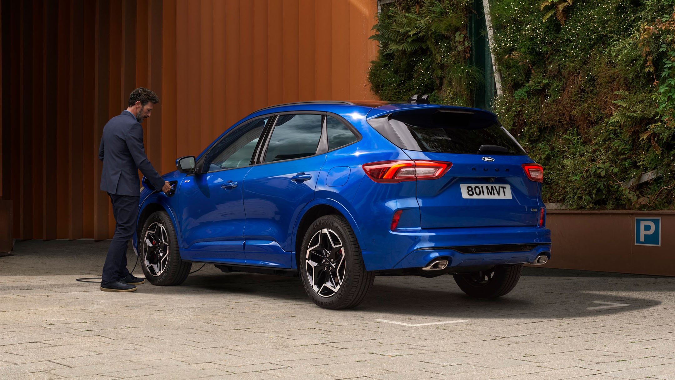 Blue Kuga PHEV being charged
