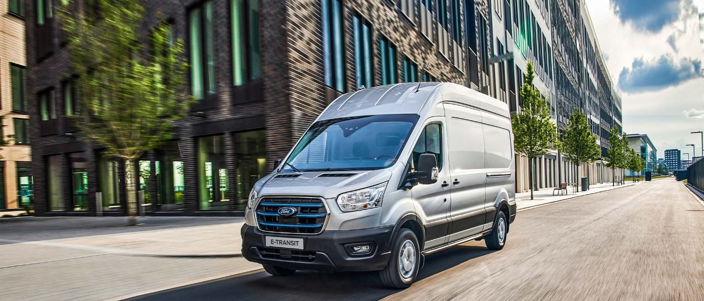Ford E-Transit driving in town