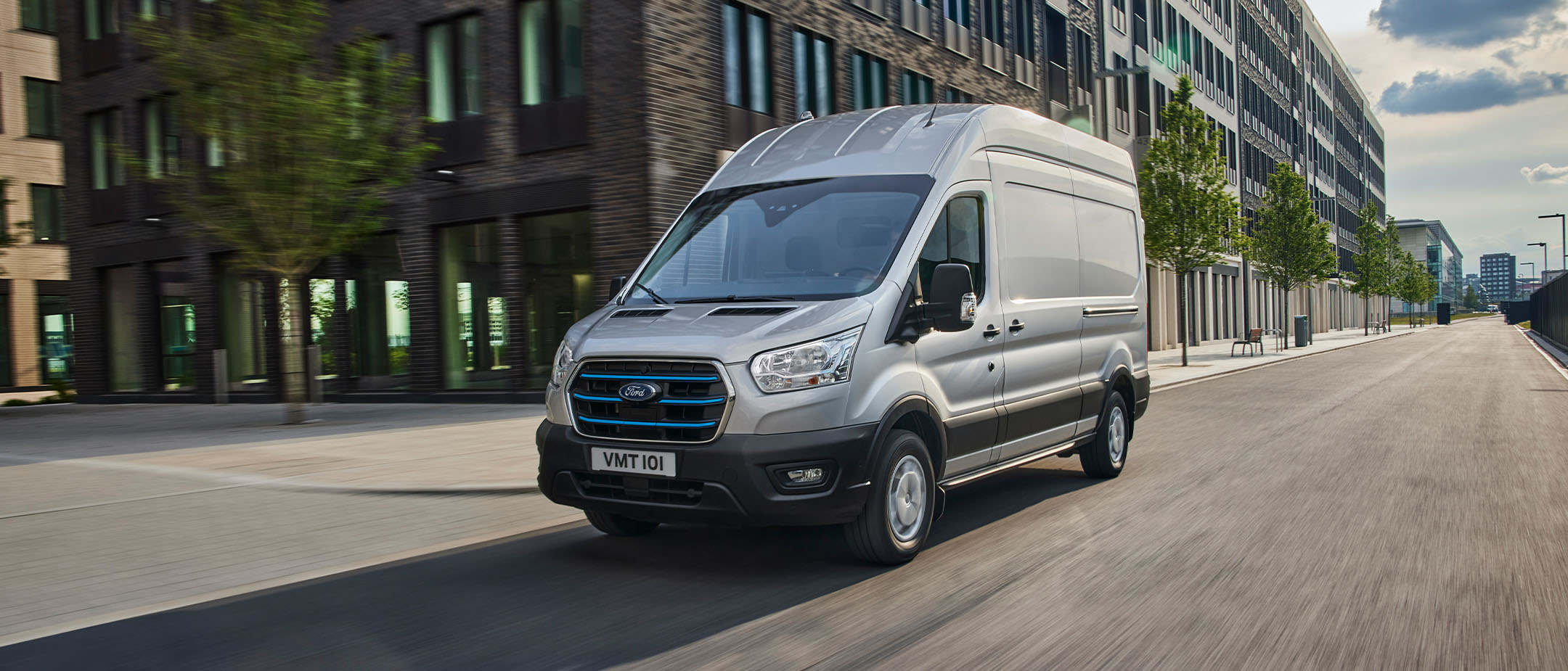 Ford E-Transit driving in town