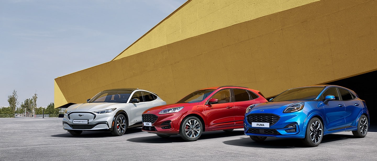Ford Mach-E, Ford Kuga and Ford Puma parking in a front of building