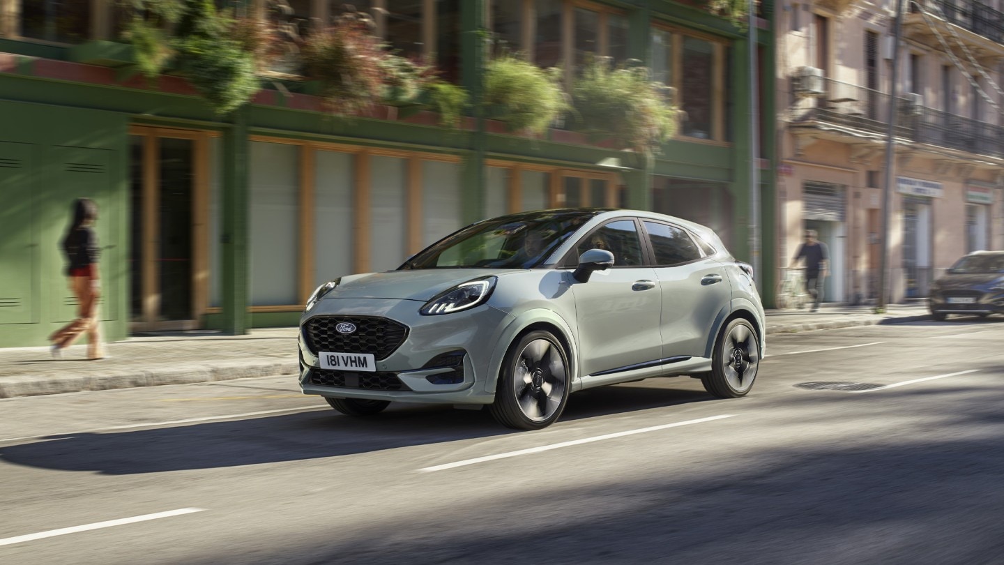 Blue Ford Puma driving in city