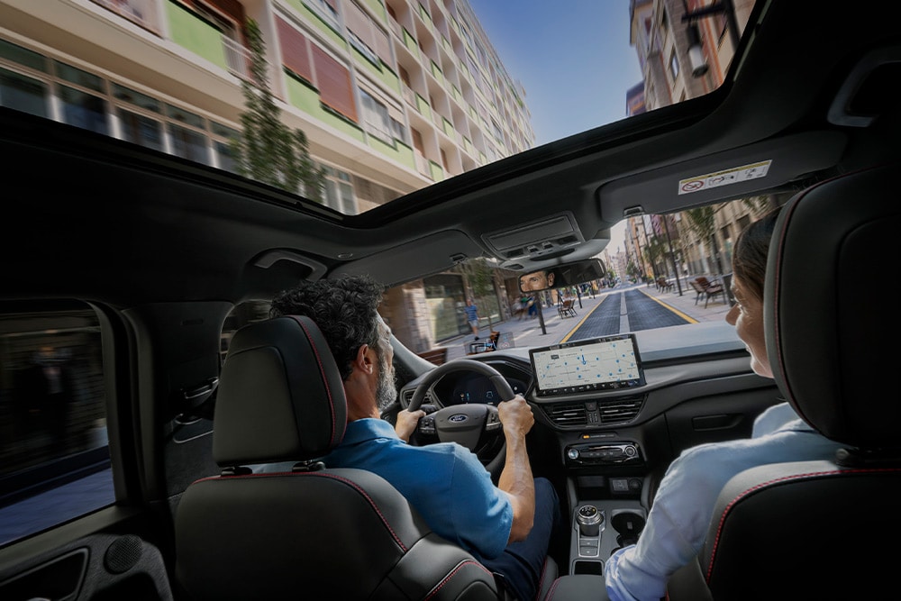An interior view of a Ford plug-in hybrid car with in-vehicle navigation. 