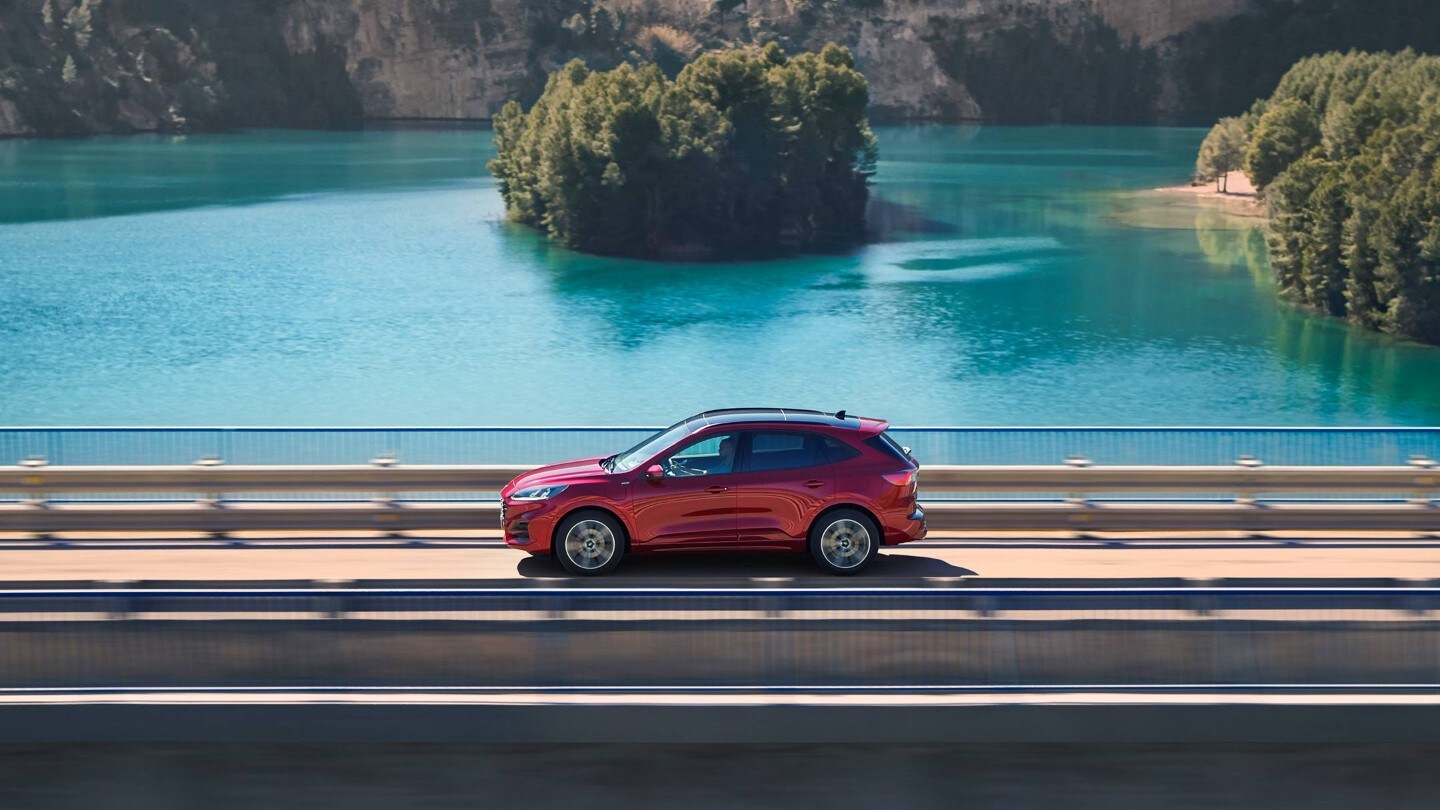 All Electric red Kuga in the street lights