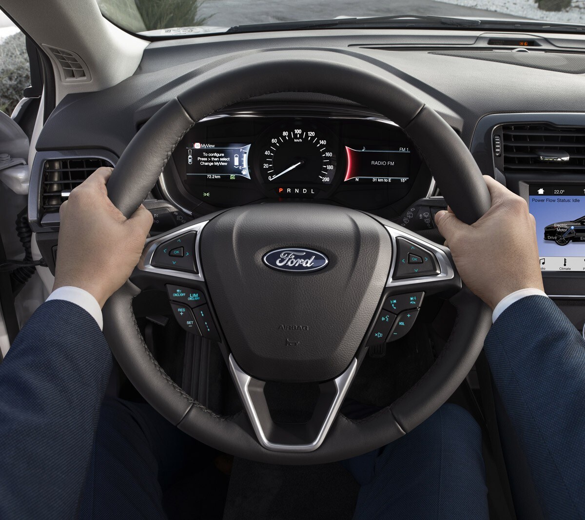 Ford Mondeo interior close up of hands with steering wheel and dashboard