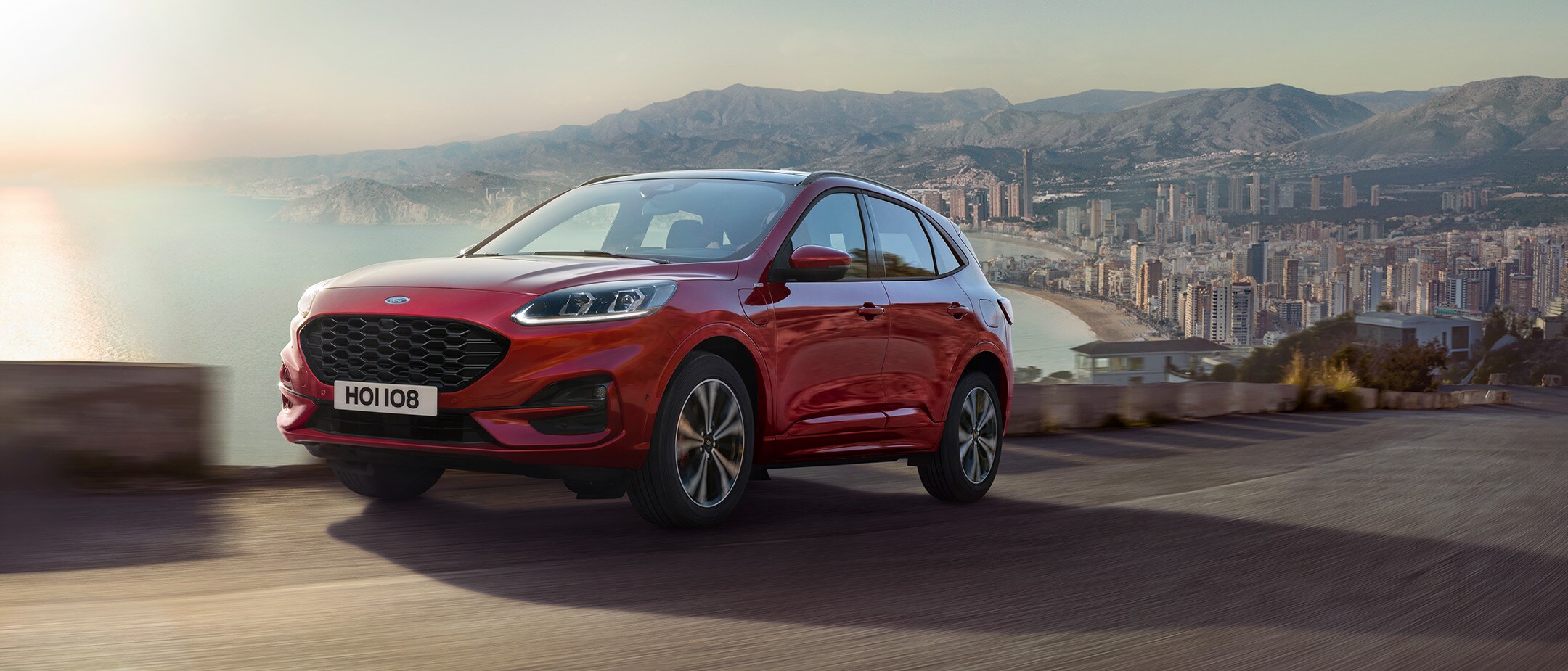 Ford Kuga driving out of a city