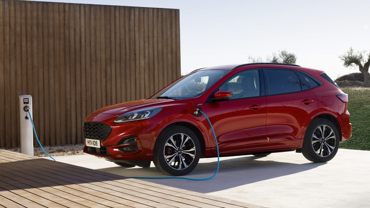 Red All-New Ford Kuga PHEV charging from home