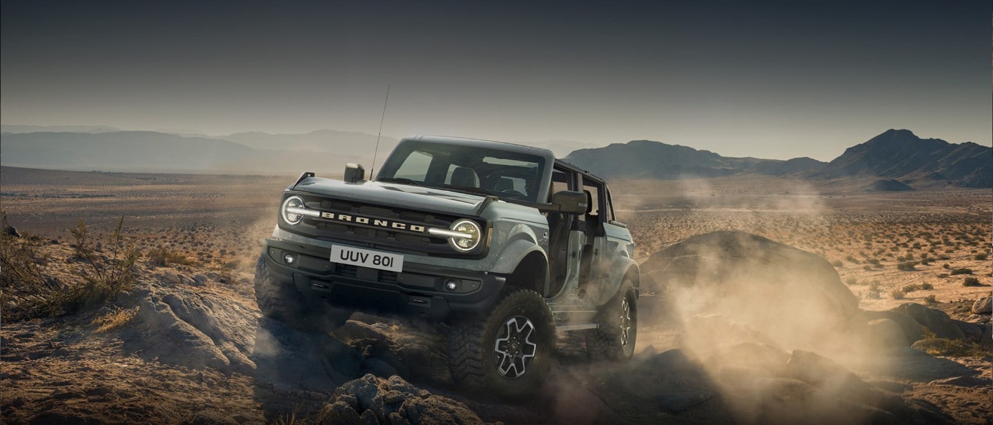 Ford Bronco driving off-road.