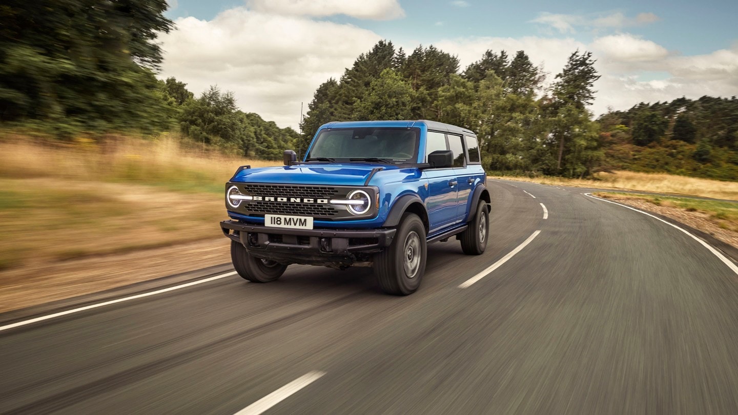 Ford Bronco front 3/4 view driving on country road