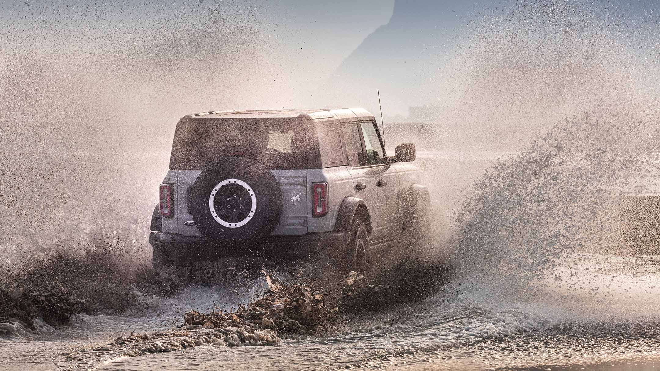 Ford Bronco rear view driving through water