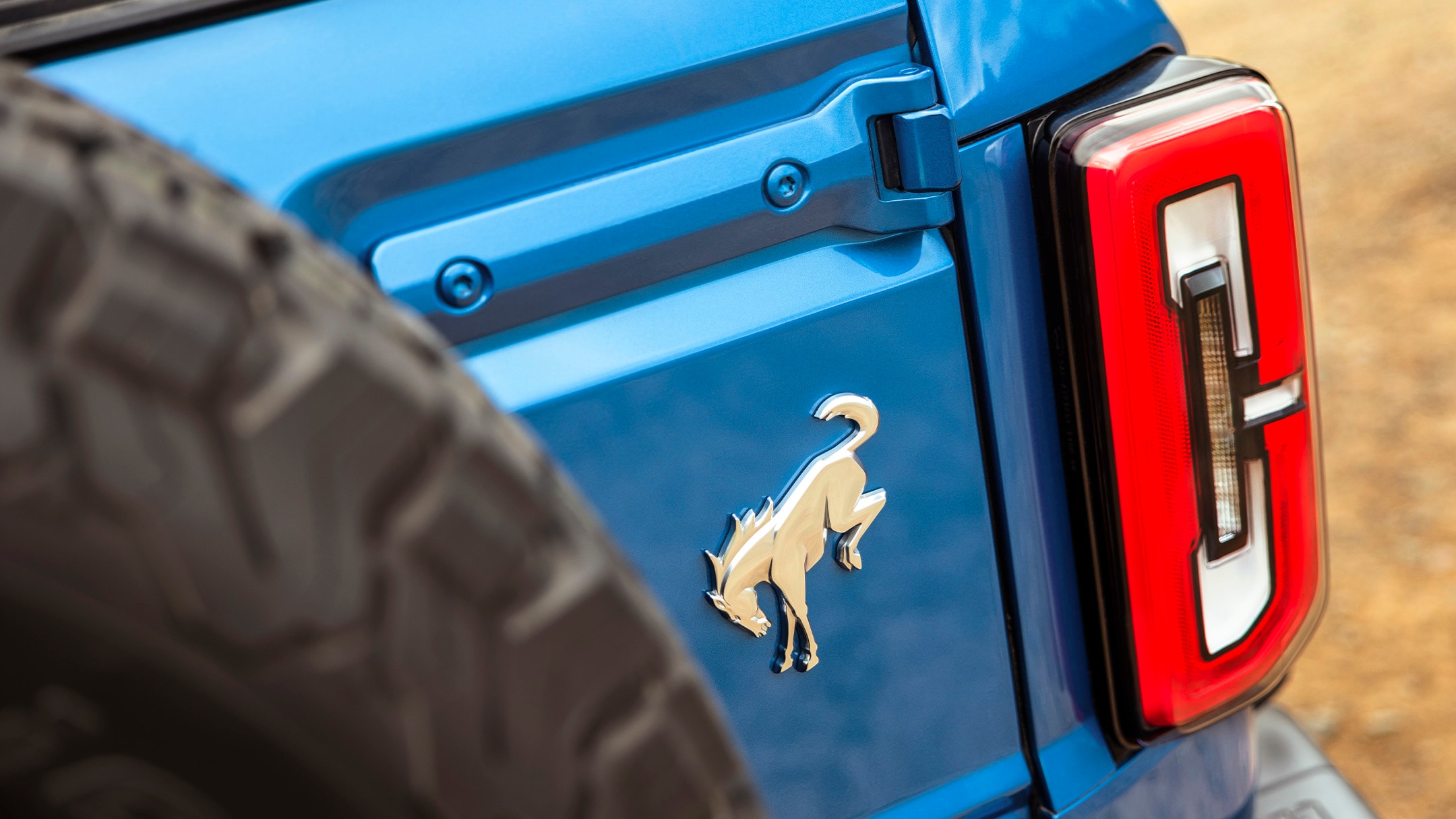 Iconic Ford Bronco badge and rear light close-up