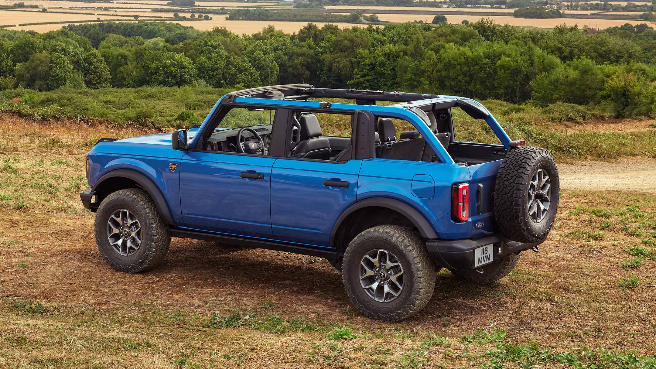 Ford Bronco parked offroad with roof panels removed