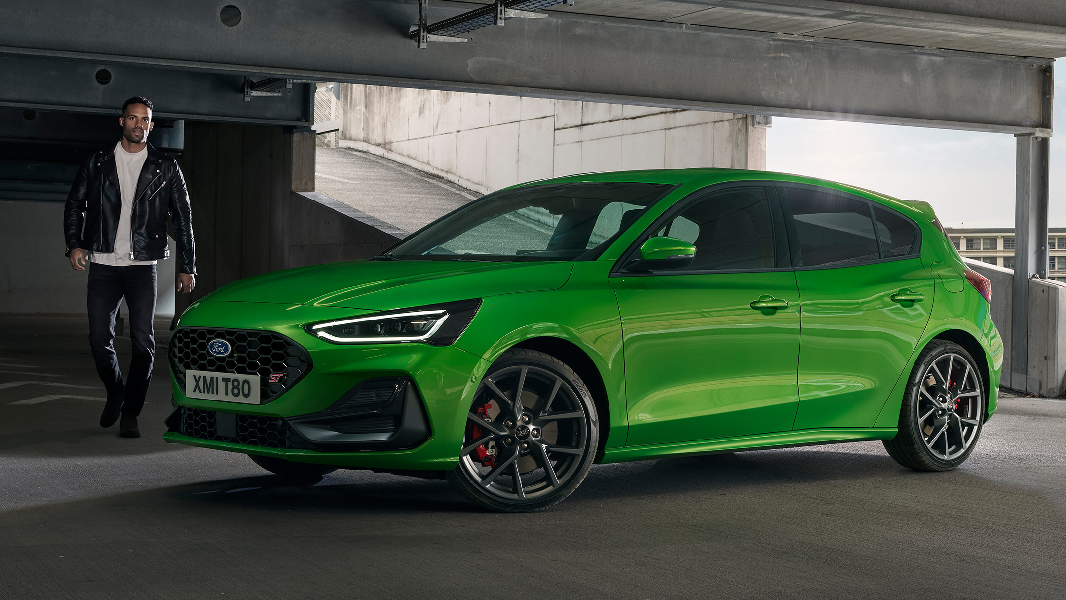 Man approaching a parked Focus ST