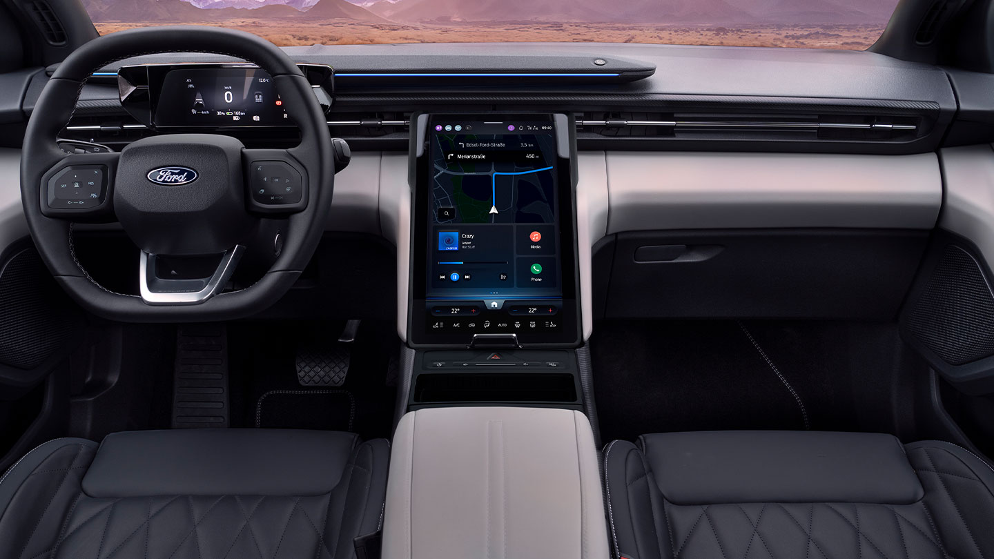 A close up of the dashboard of the Ford Explorer, showing the steering wheel and large 14.6" SYNC Move touchscreen. 