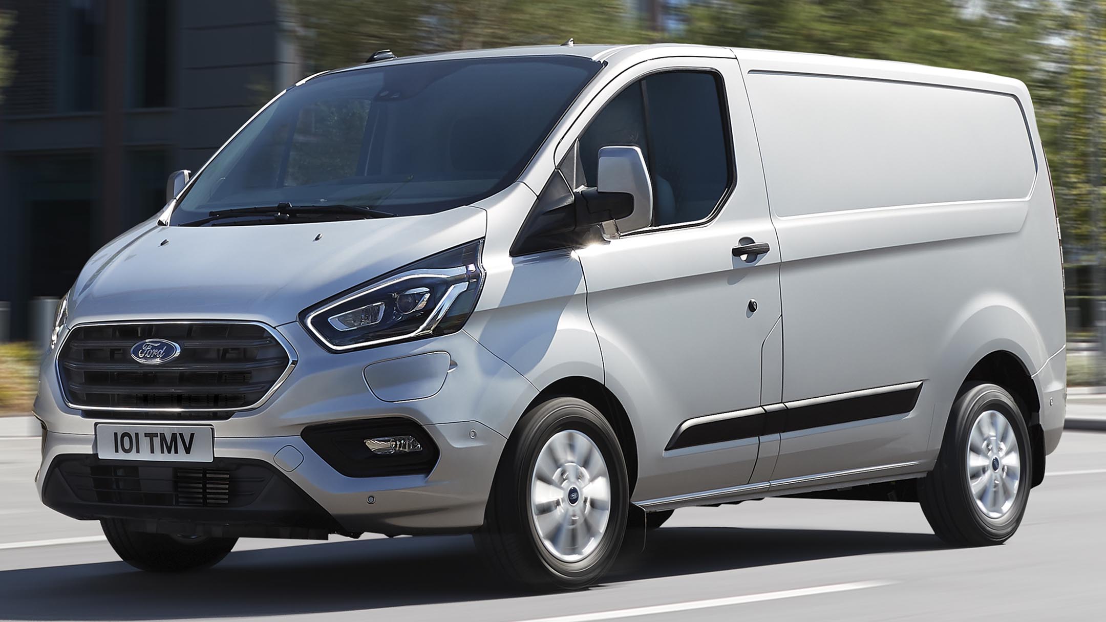 Silver Ford Transit Custom driving