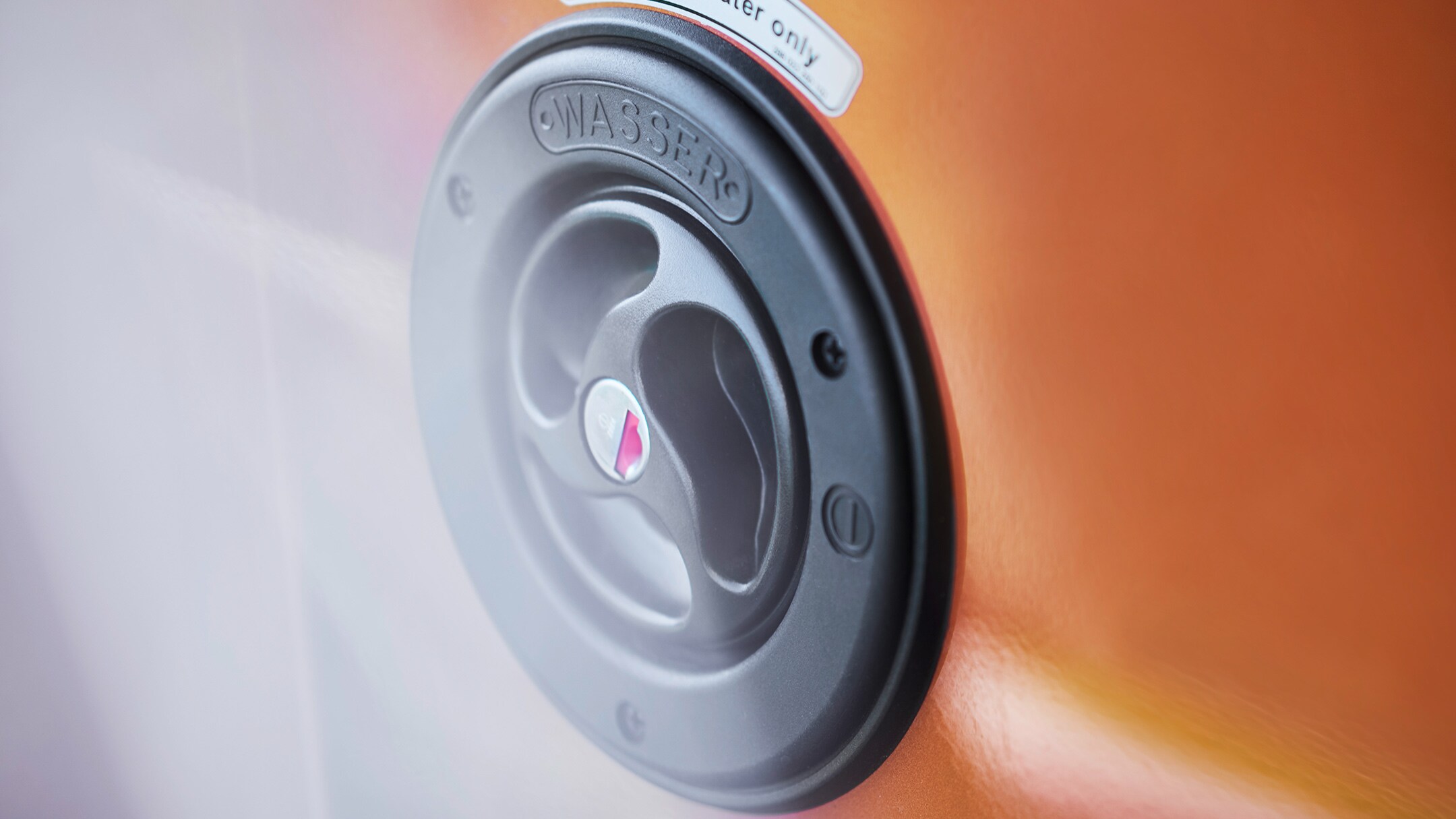 Orange Ford Transit Custom Nugget close up of recharging point