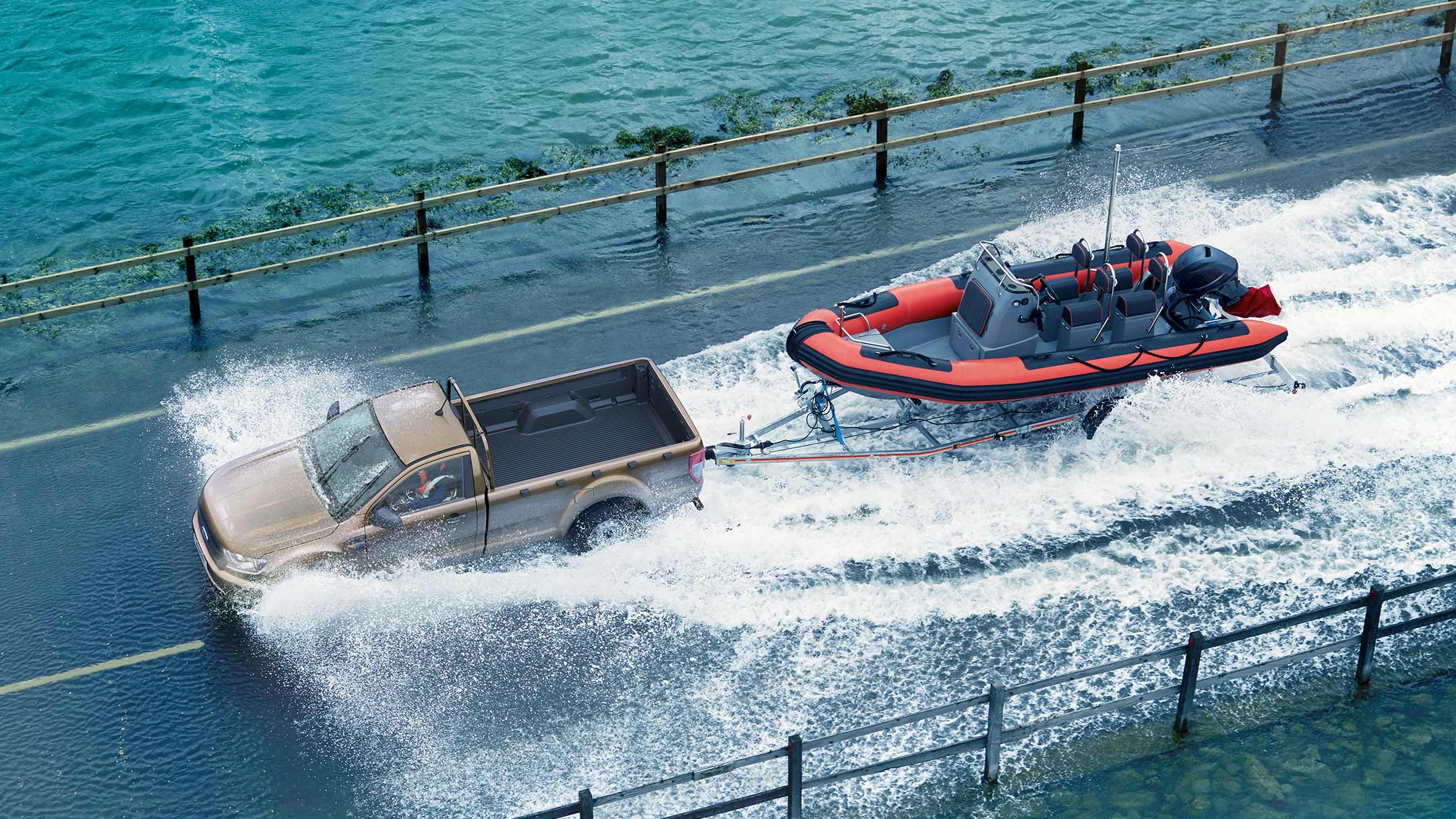 Silver Ford Ranger towing speedboat