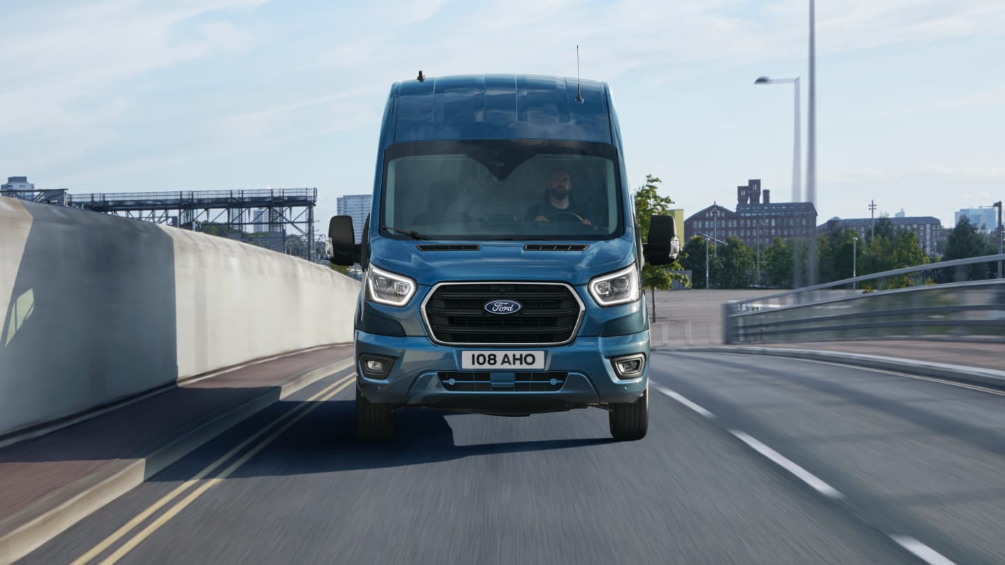 A person using the rotating gear select dial in the New Ford Transit