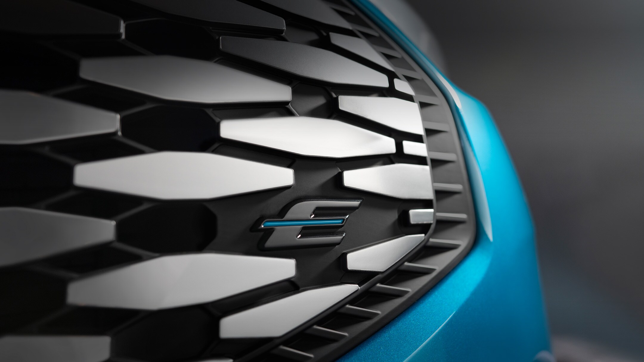 Ford E-Transit Custom in blue grill close-up