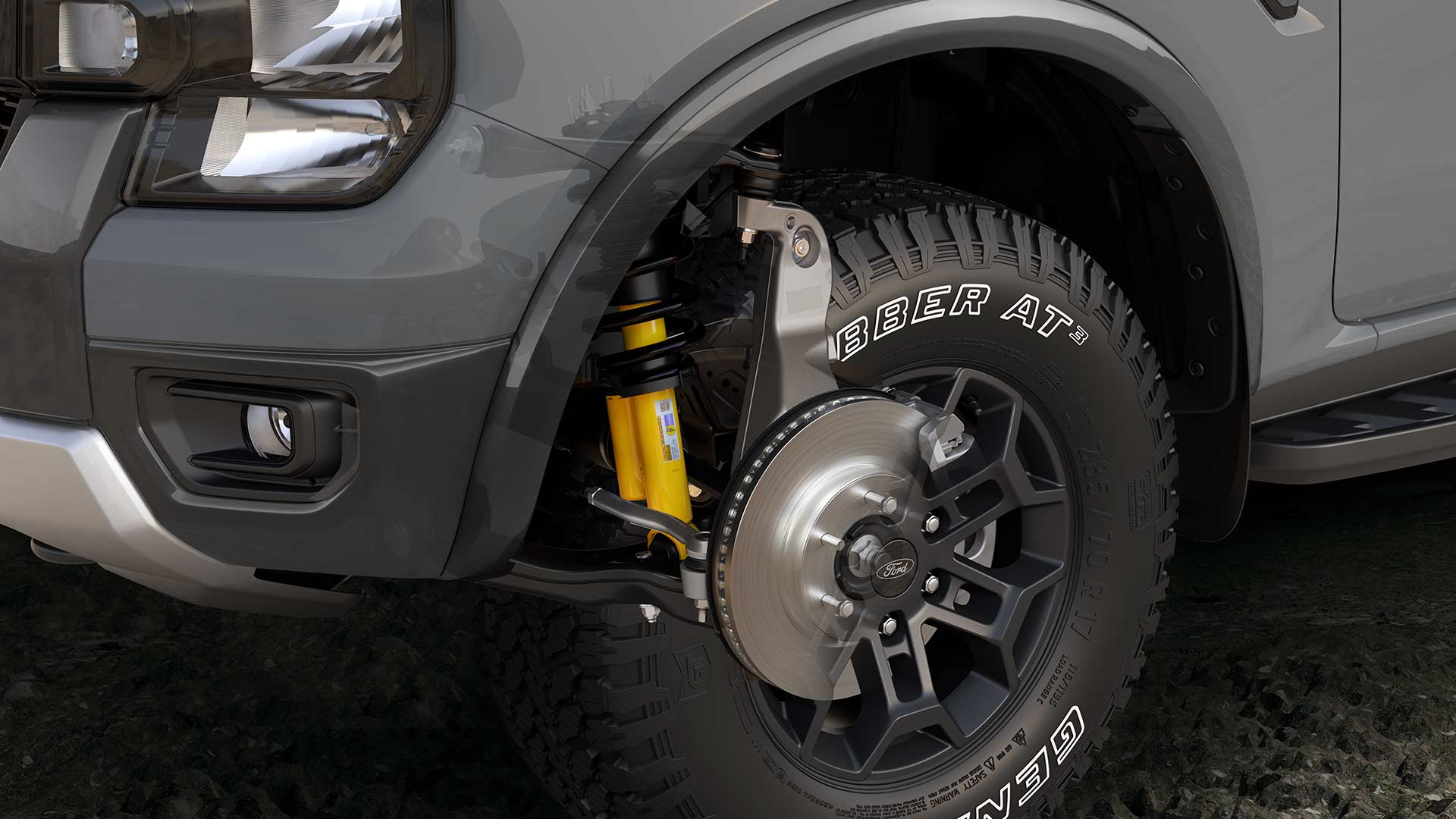 Een close-up van het wiel en de wielophanging van een Ford Ranger met dubbele cabine.