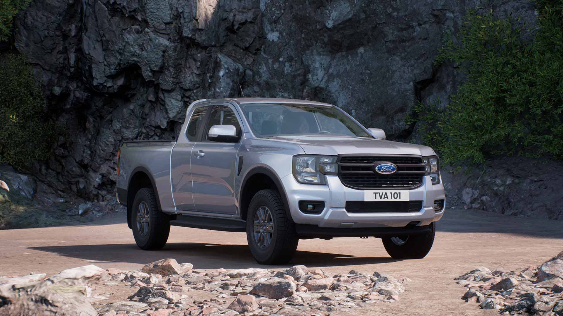 Een zilveren Ford Ranger met supercabine XLT, geparkeerd op rotsachtig terrein.