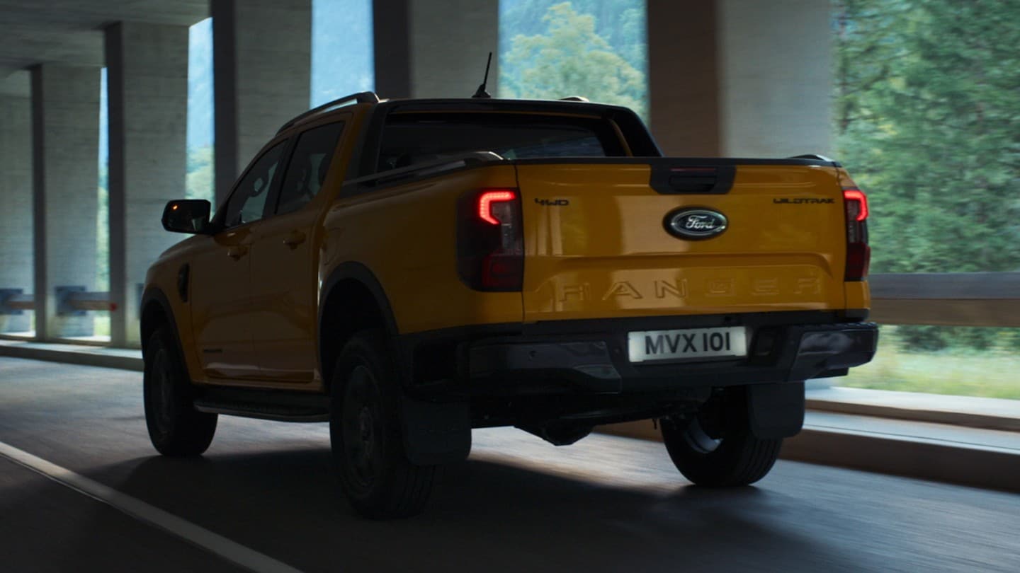 All-New Ford Ranger rear 3/4 view driving under overpass