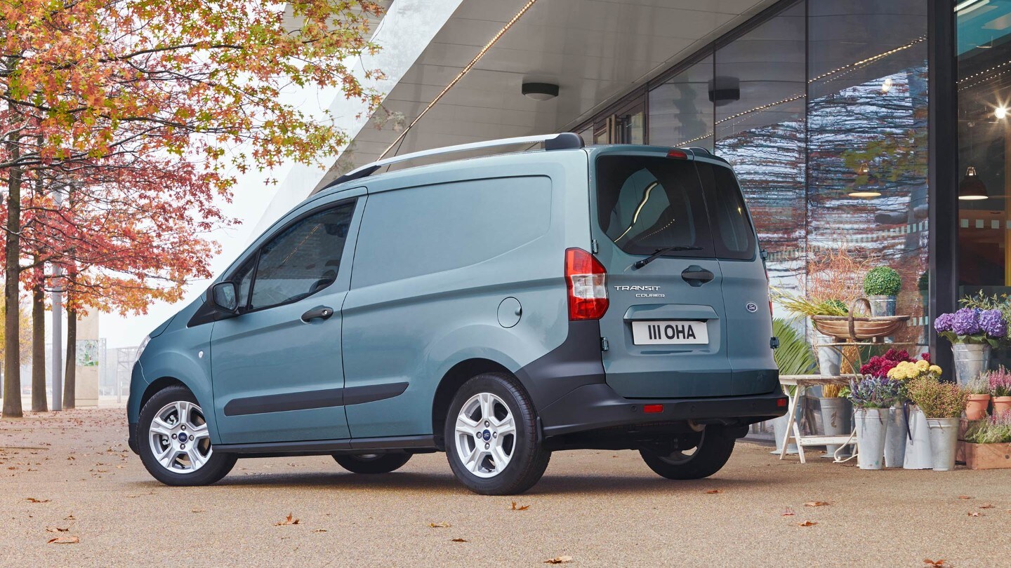 Ford Transit Courier parked next to florist store